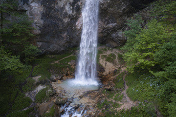 Fototapeta na wymiar drone flight over giant big waterfall called Wildensteiner waterfall in austria