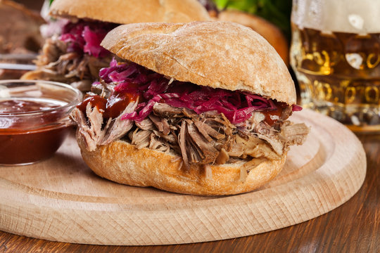 Pulled pork sandwich with red cabbage and bbq sauce