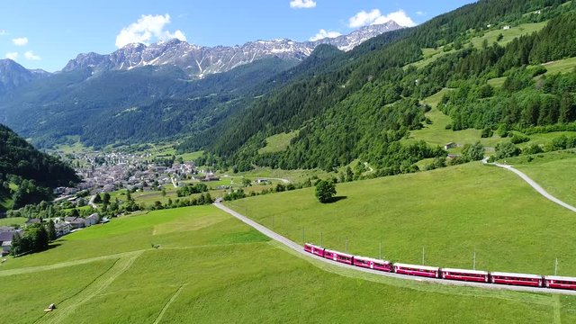 Red train of Bernina in Val Poschiavo, aerial view
