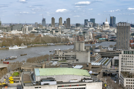 Aerial view of cityscape and skyline of London with the Thames, a major river that flows through southern England, most notably through London, United Kingdom
