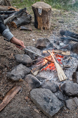 Cooking sausage on camp fire