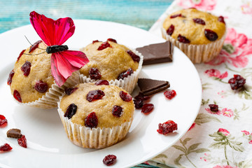 Muffins with cherry on a blue background, horizontal
