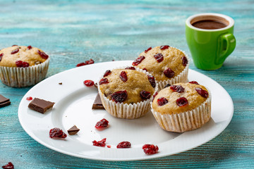 Muffins with cherry on a blue background, horizontal