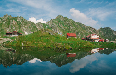 Fototapeta premium Balea glacier lake in Transfagarasan pass at summer. Crossing Carpathian mountains in Romania, Transfagarasan is one of the most spectacular mountain roads in the world