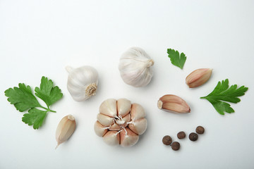 Flat lay composition with garlic on light background