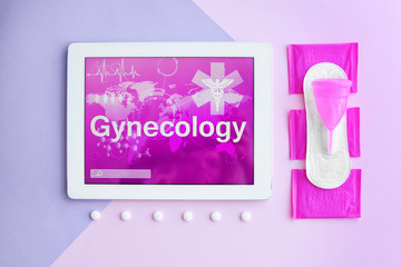 Flat lay composition with tablet, pills and feminine hygiene items on color background. Gynecological care