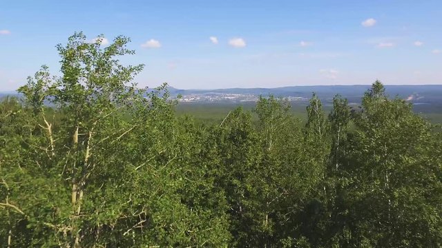 Zlatoust city - Large industrial city in the Ural mountains, Chelyabinskaya oblast, Russia. Aerial view at summer sunny day