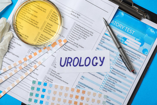 Flat lay composition with word "Urology" and test forms on color background
