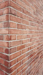 Red brick stone wall texture, Corner of the building. rusty blocks of stone background
