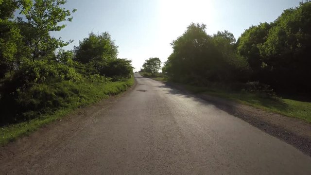 POV Driving through the Quantock Hills in Somerset, England with sheep along the road
