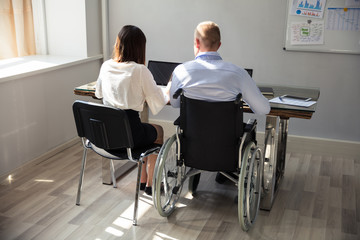 Disabled Businessman Working On Laptop