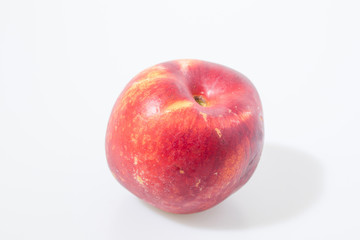 Fototapeta na wymiar Red peach fruit isolated in a white background