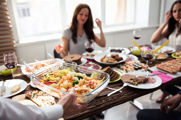 Waiter Holding Bowl Of Food