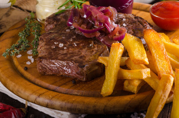 Beef steak with homemade french fries, beer and tartar sauce