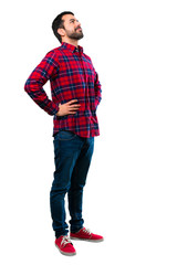 Fototapeta premium Handsome man standing and looking to the side