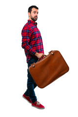 Handsome man holding a vintage briefcase