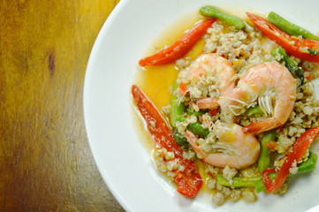 spicy stir fried minced pork and prawn with basil leaf on plate