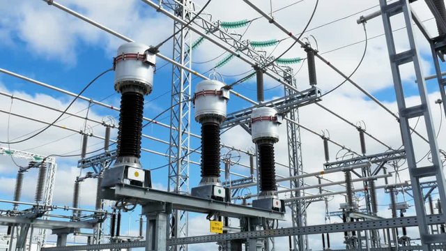 large electrical transmission station with cables and insulators
