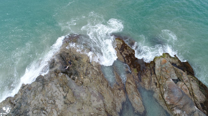 Aerial of the sea wave clashing on rocks. Phang Nga, Thailand. December 2017.