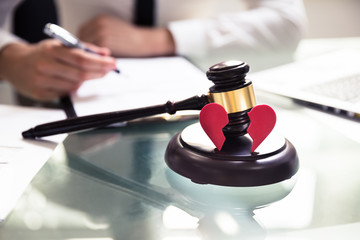 Close-up Of Broken Heart And Wooden Mallet