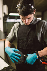 Mechanic man with a polisher