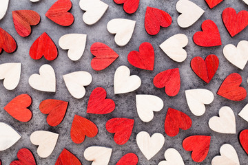 Background with wooden hearts, place for text.