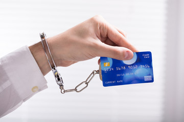 An Arrested Person Hand Linked To Credit Card