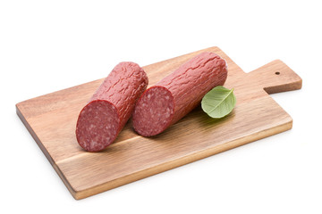 Salami smoked sausage, basil leaves on white background cutout.