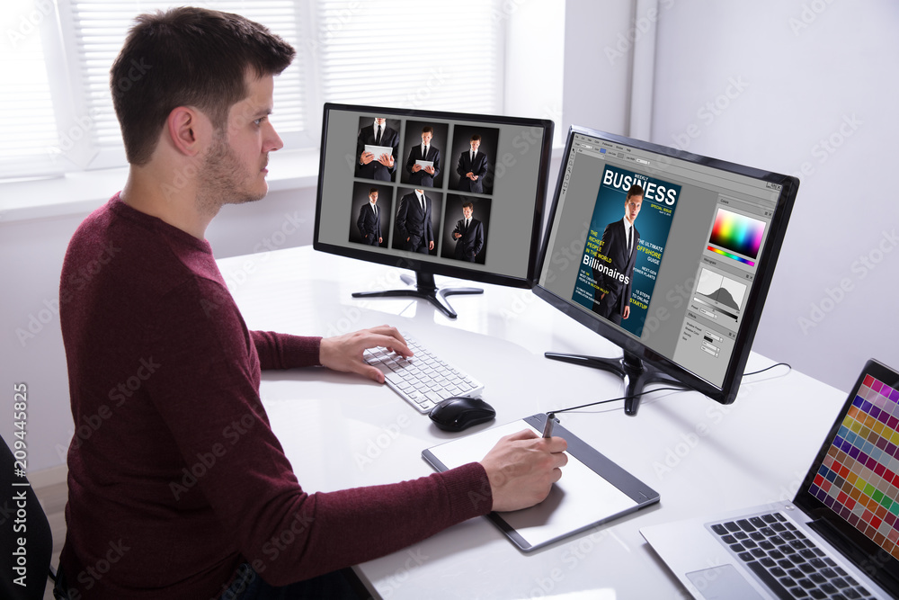 Leinwandbilder designer drawing on graphic tablet while working on computer