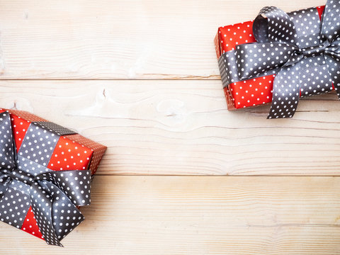 Composition of packed present boxes on wooden board. Celebrations concept