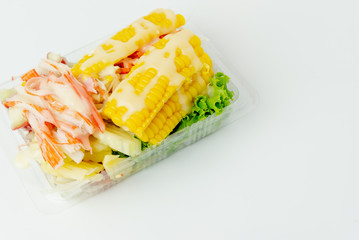 Salad with spinach cherry tomatoes, corn salad Homemade food. Concept for a tasty and healthy concept on white background.