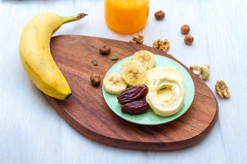 Mix of Dried Nuts and Fruits on Wooden Table