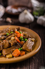Pork medallions with vegetable and soy garlic sauce