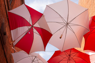 Display of red and white umbrellas