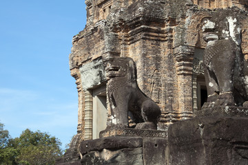 Fototapeta na wymiar Siem Reap Cambodia, lion statues protecting the ruins of 10th Century East Mebon temple 