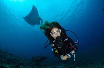 Underwater girl and manta