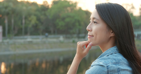 Woman enjoy the sunset view at the lakeside © leungchopan