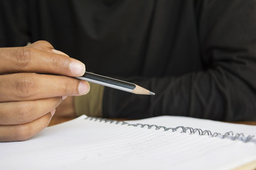 human hand writing a note