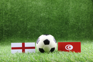 ball with England VS Tunisia flag match on Green grass football 2018