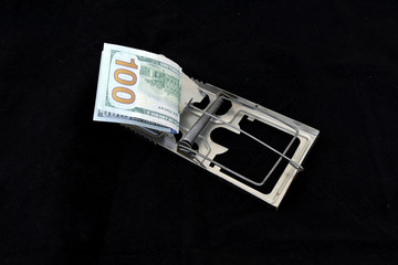 $ 100, which is put as bait to the mouse trap,
people fall into a trap because of money,


