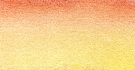 Textured paper colored with real watercolor in yellow and orange gradient. Hand drawn illustration.