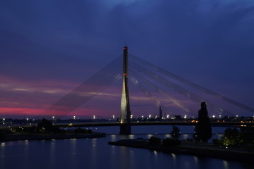 View at the Vanšu Bridge and the Daugava river in Riga, Latvia at night