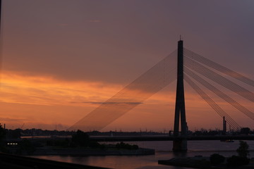 Obraz premium View at the Vanšu Bridge and the Daugava river in Riga, Latvia at night