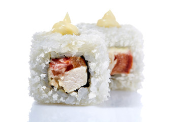 Traditional fresh japanese sushi rolls on a white background, close-up, selective focus.