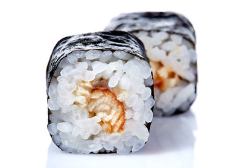 Traditional fresh japanese sushi rolls on a white background, close-up, selective focus.