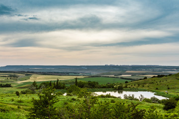 Fototapeta na wymiar meadows with fields and lake