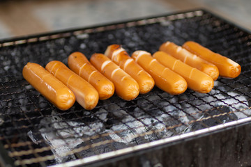 Sausage put on grill ,Fast food energy on morning. Image use for cook in the kitchen.