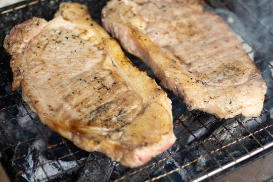 Beef steak put on grill , High energy foods. Image use for cook in the kitchen.