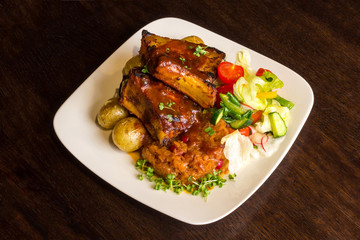 Dish with pork ribs and vegetables