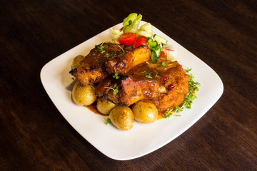 Dish with pork ribs and vegetables